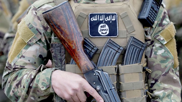 A patch of Islamic State is attached on a fighter's uniform, on the day Khaled Brigade, a part of Hay'at Tahrir al-Sham (HTS), hold a military parade, after Syria's Bashar al-Assad was ousted, in Damascus, Syria, December 27, 2024. REUTERS/Amr Abdallah Dalsh.
